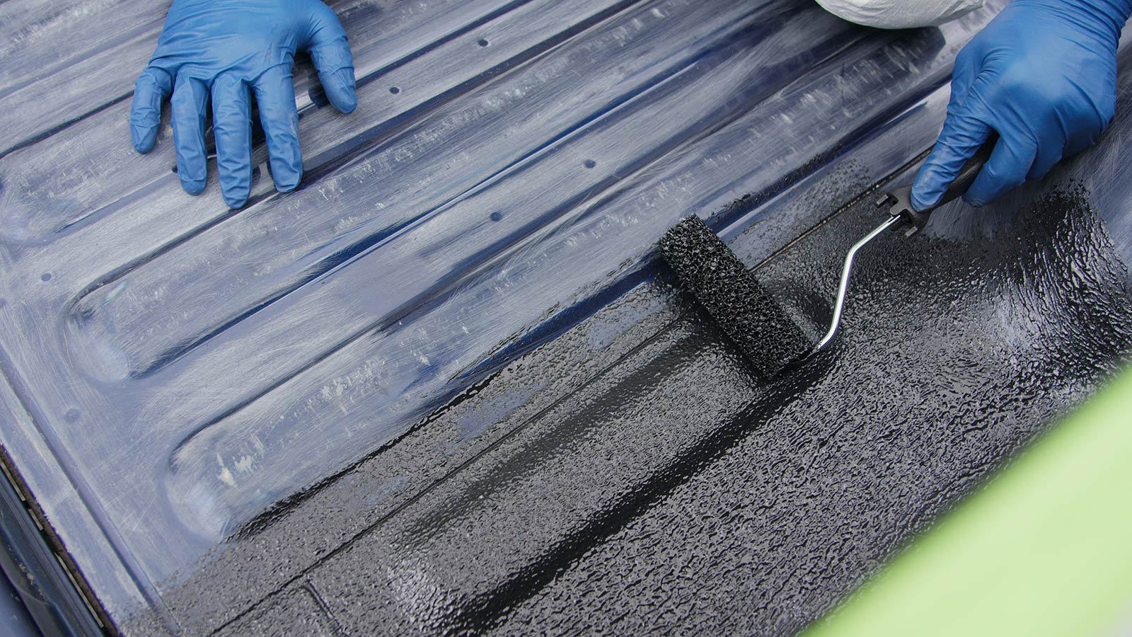 applying truck bed liner with a roller